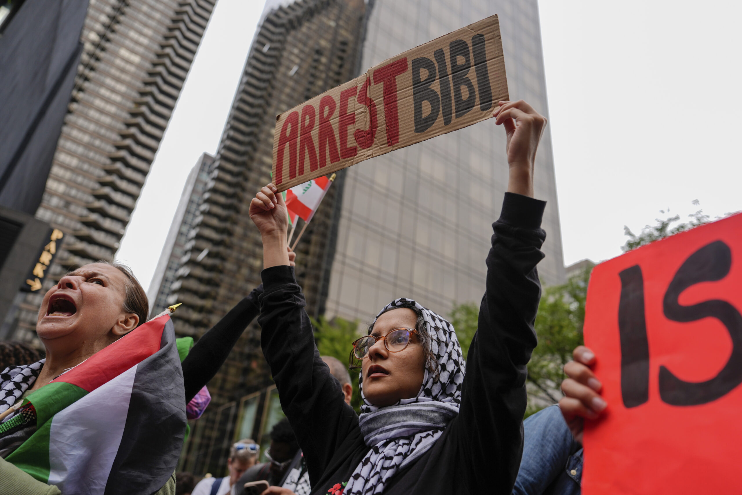 Palestinian supporters march near the United Nations headquarters at a protest against Israeli Prim...