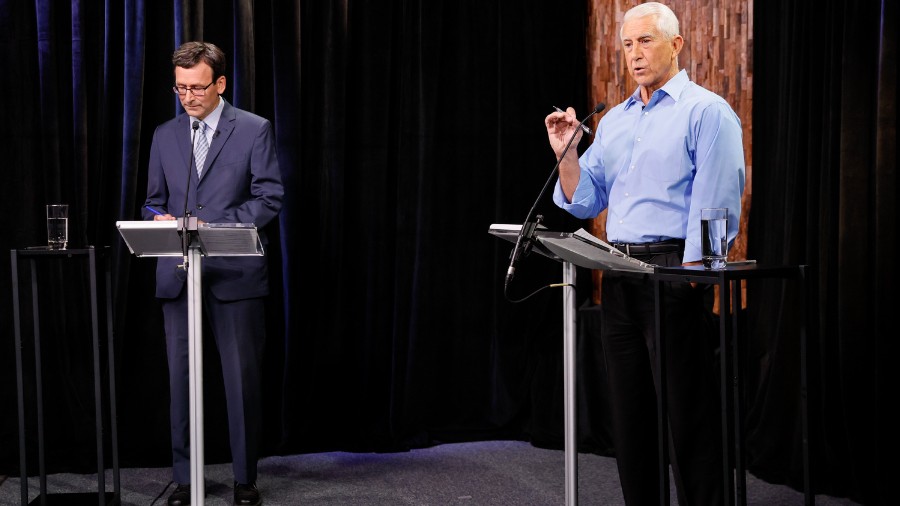 Image: Democrat Bob Ferguson, left, and Republican Dave Reichert, right, take part in the Washingto...