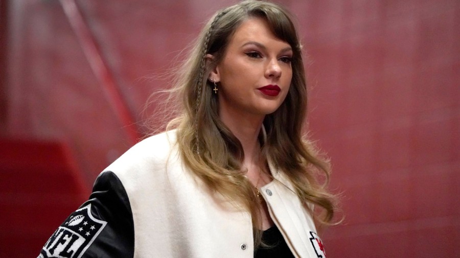 Image: Taylor Swift enters Arrowhead Stadium in Kansas City, Missouri, before the start of an NFL g...