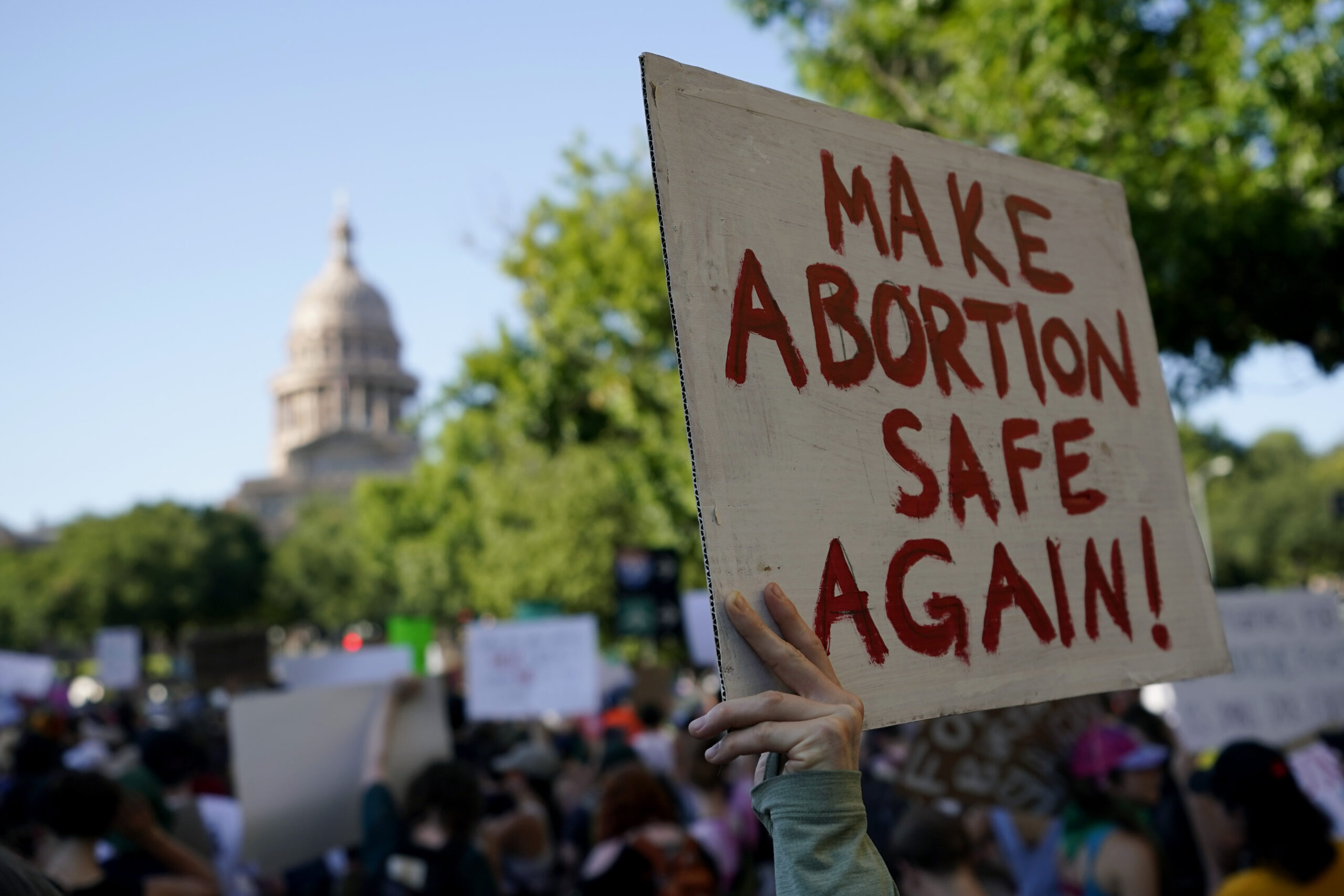 FILE - Demonstrators march and gather near the Texas Capitol following the U.S. Supreme Court's dec...