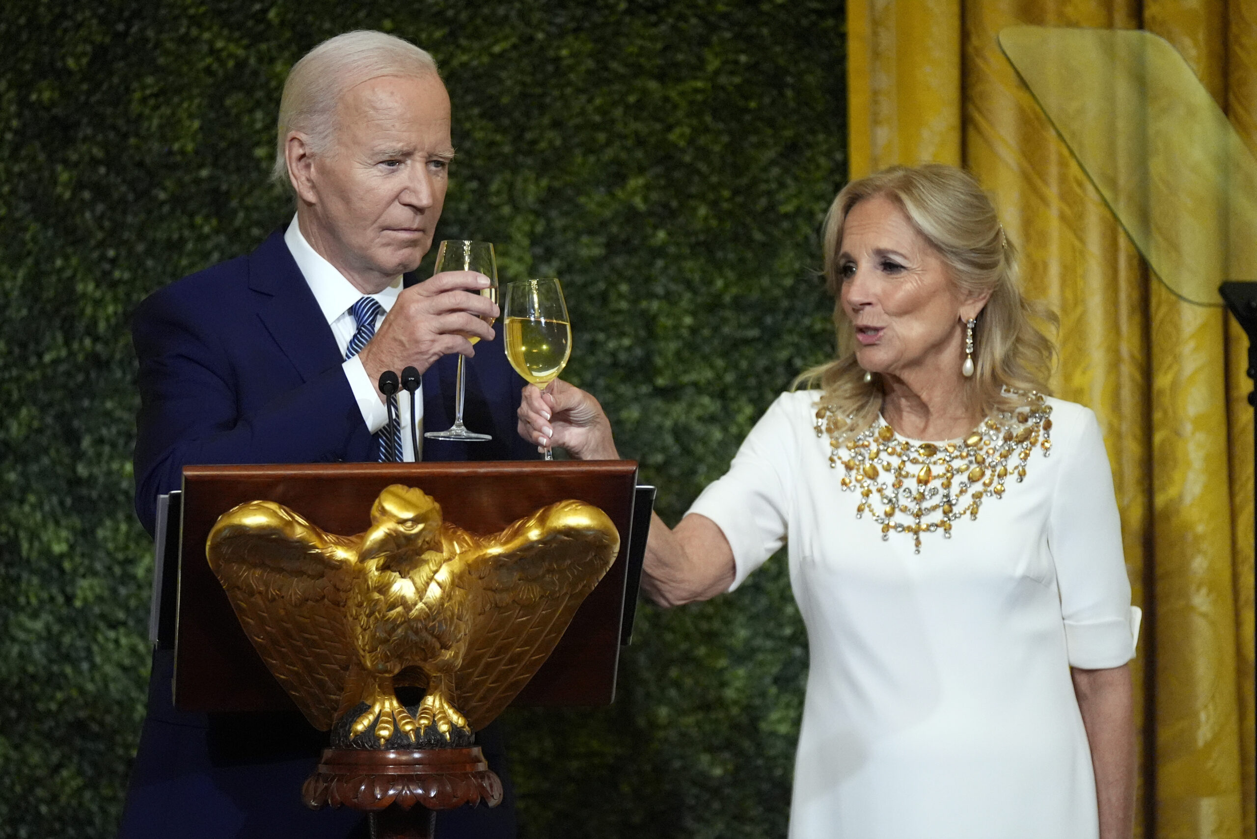 President Joe Biden and first lady Jill Biden toast at a dinner Sunday, Oct. 20, 2024, in the East ...