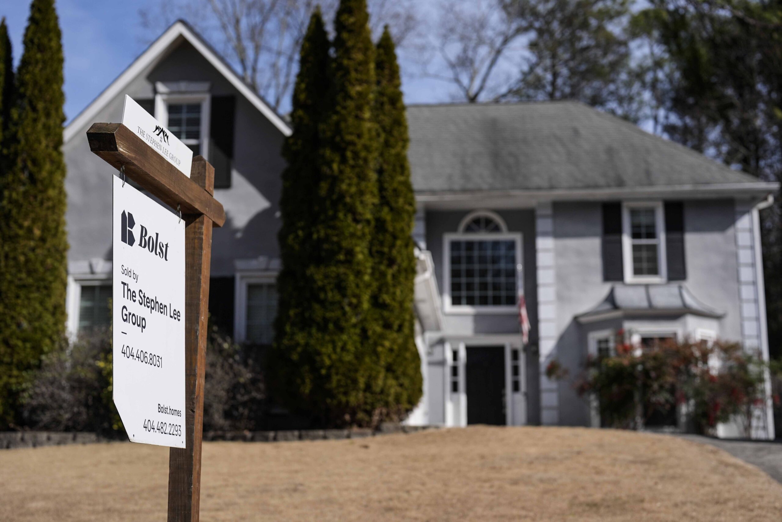 FILE - A sign announcing a home for sale is posted outside a home Feb. 1, 2024, in Kennesaw, Ga., n...