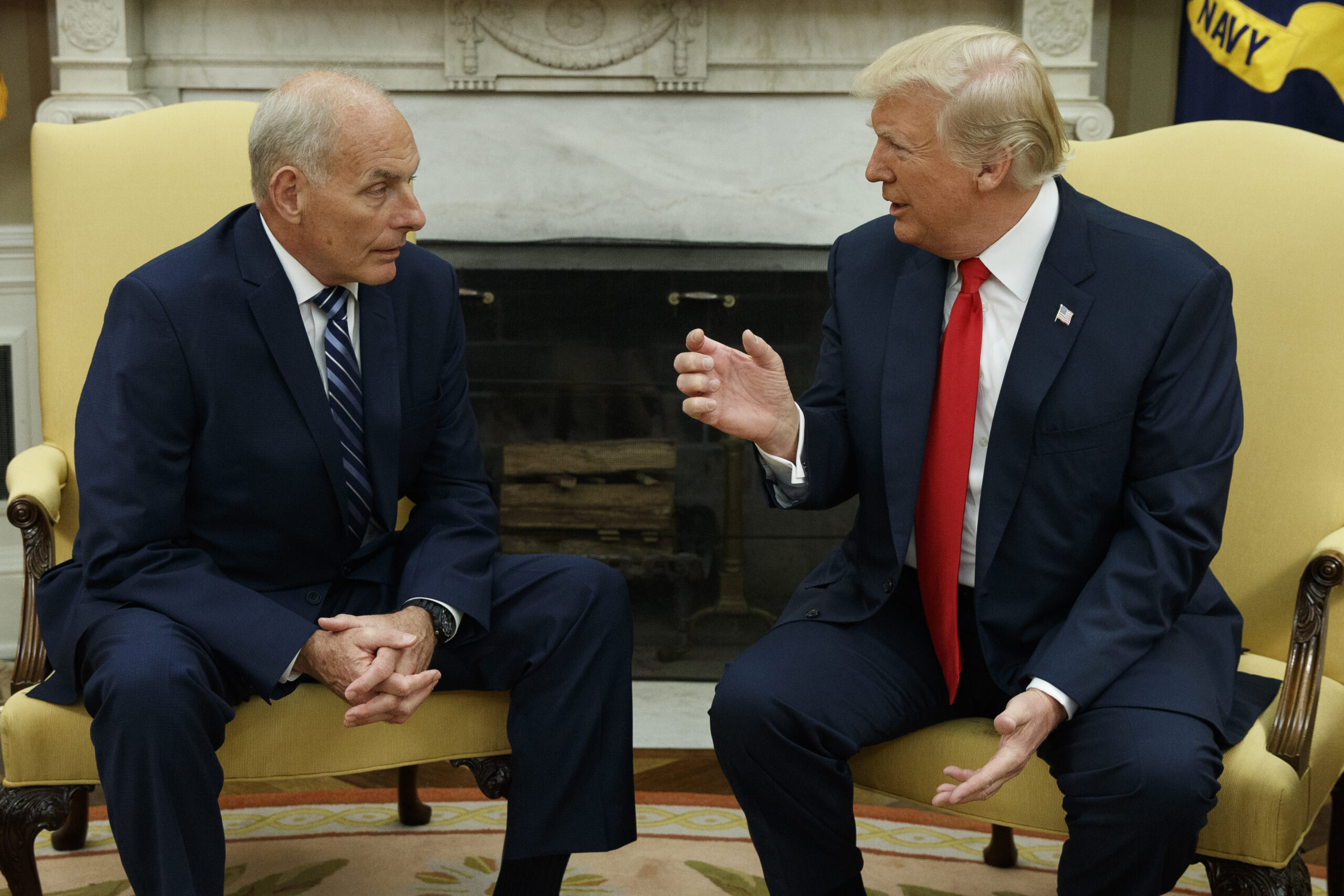 FILE - President Donald Trump talks with White House Chief of Staff John Kelly after he was private...