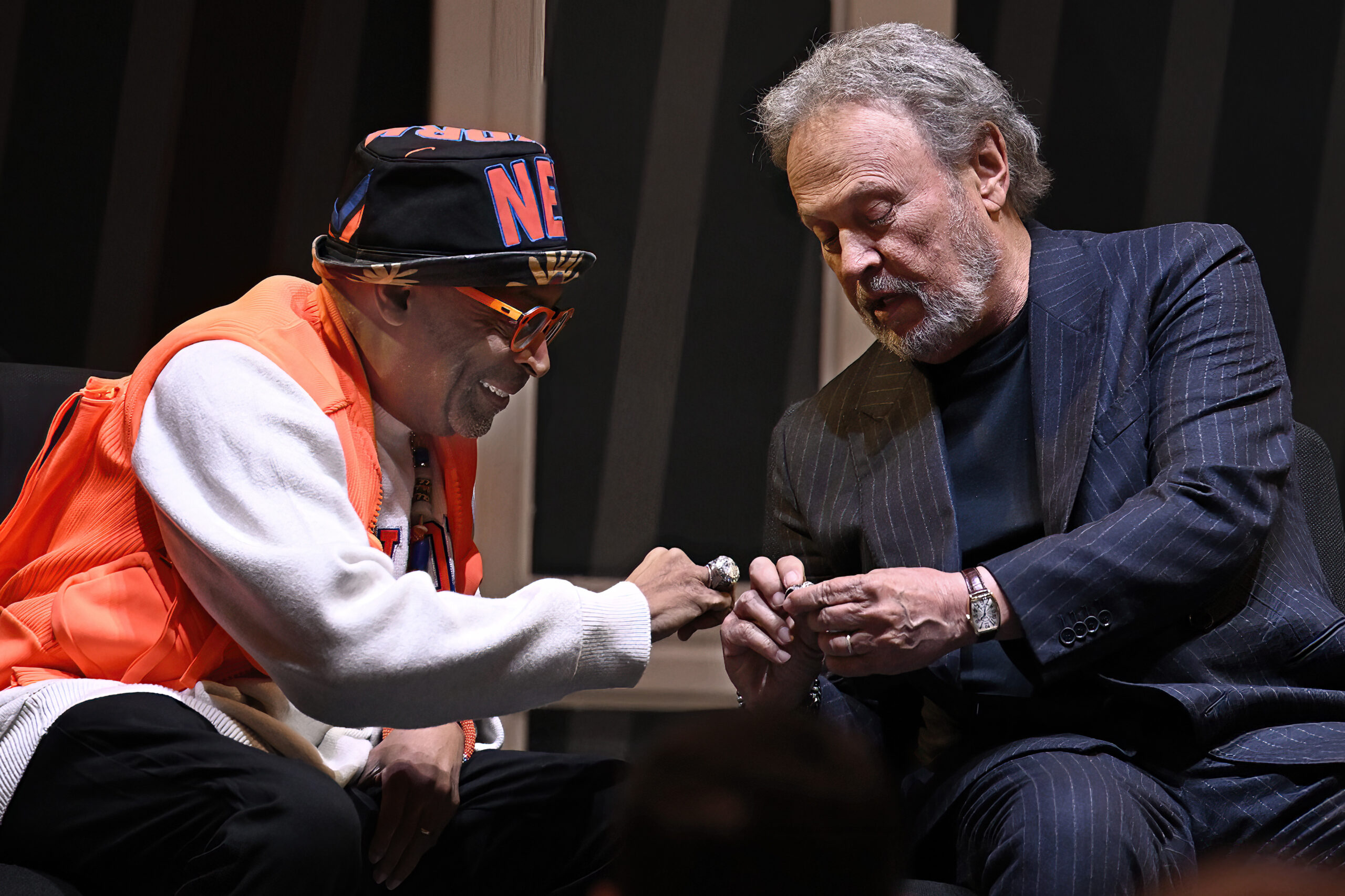 Film director Spike Lee, left, and comedian Billy Crystal, right, compare rings as they are honored...