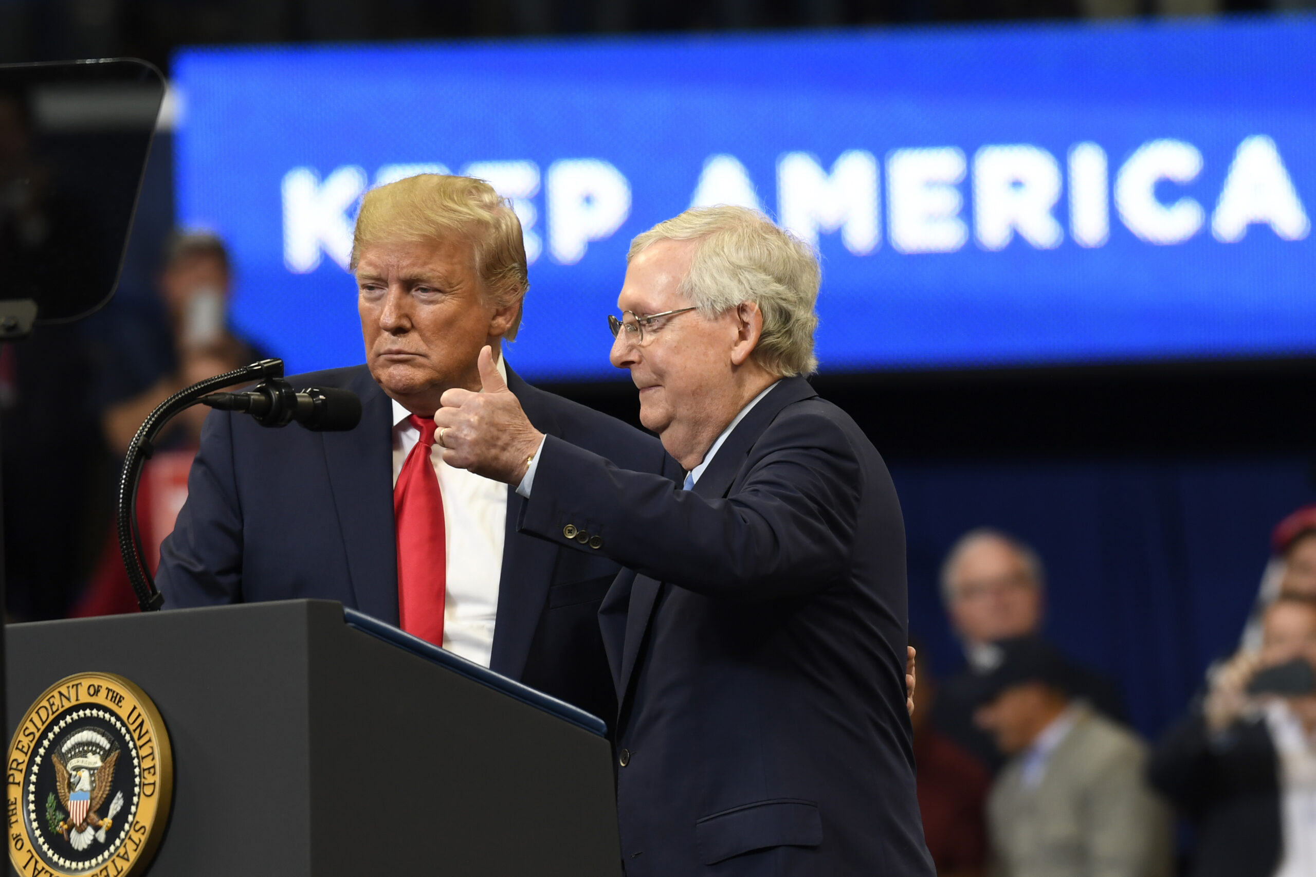 FILE - President Donald Trump brings Senate Majority Leader Mitch McConnell of Ky., on stage during...