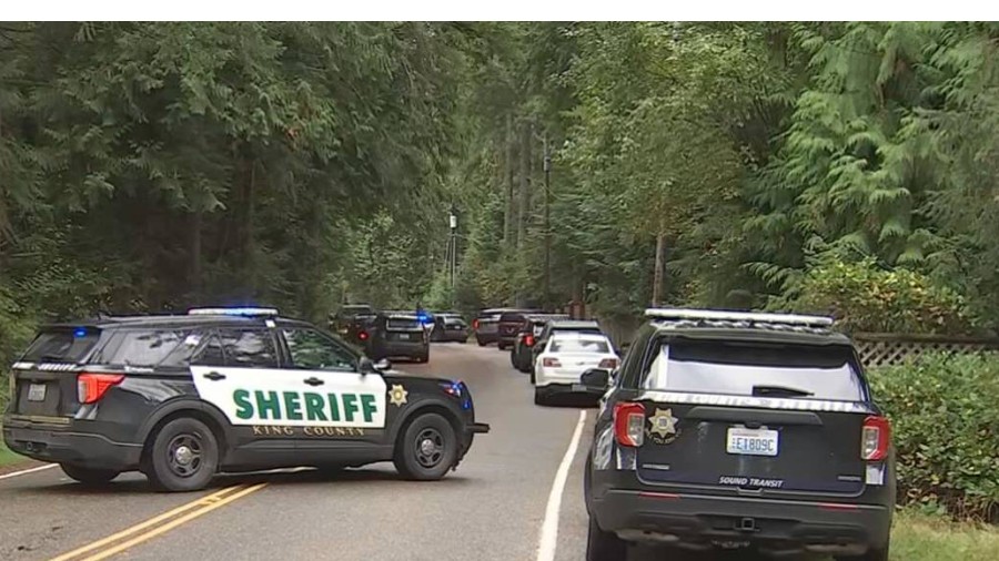 Image: King County Sherriff's Office vehicles are parked outside a shooting scene in Fall City on M...