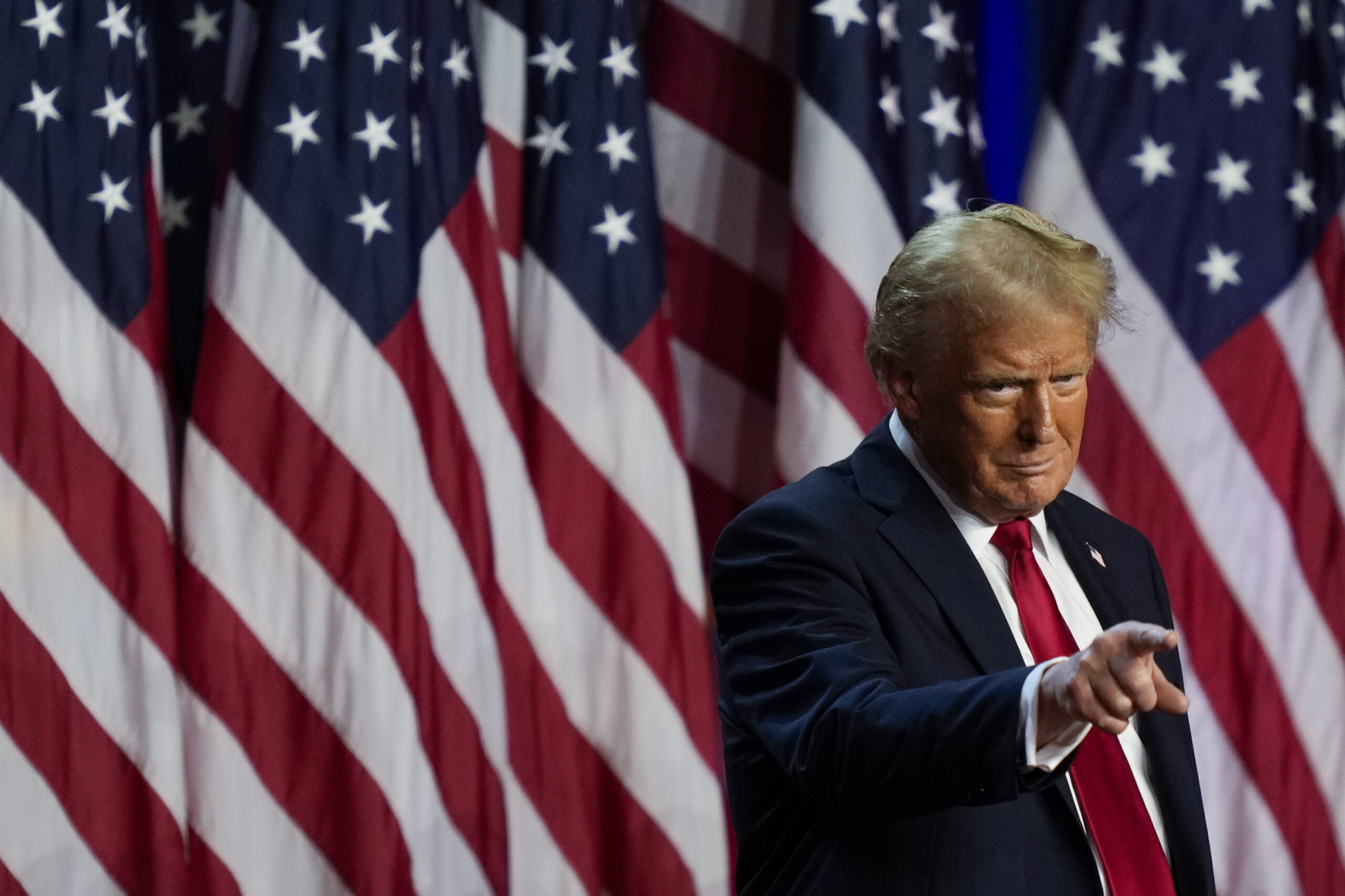 Republican presidential nominee former President Donald Trump points to the crowd at an election ni...