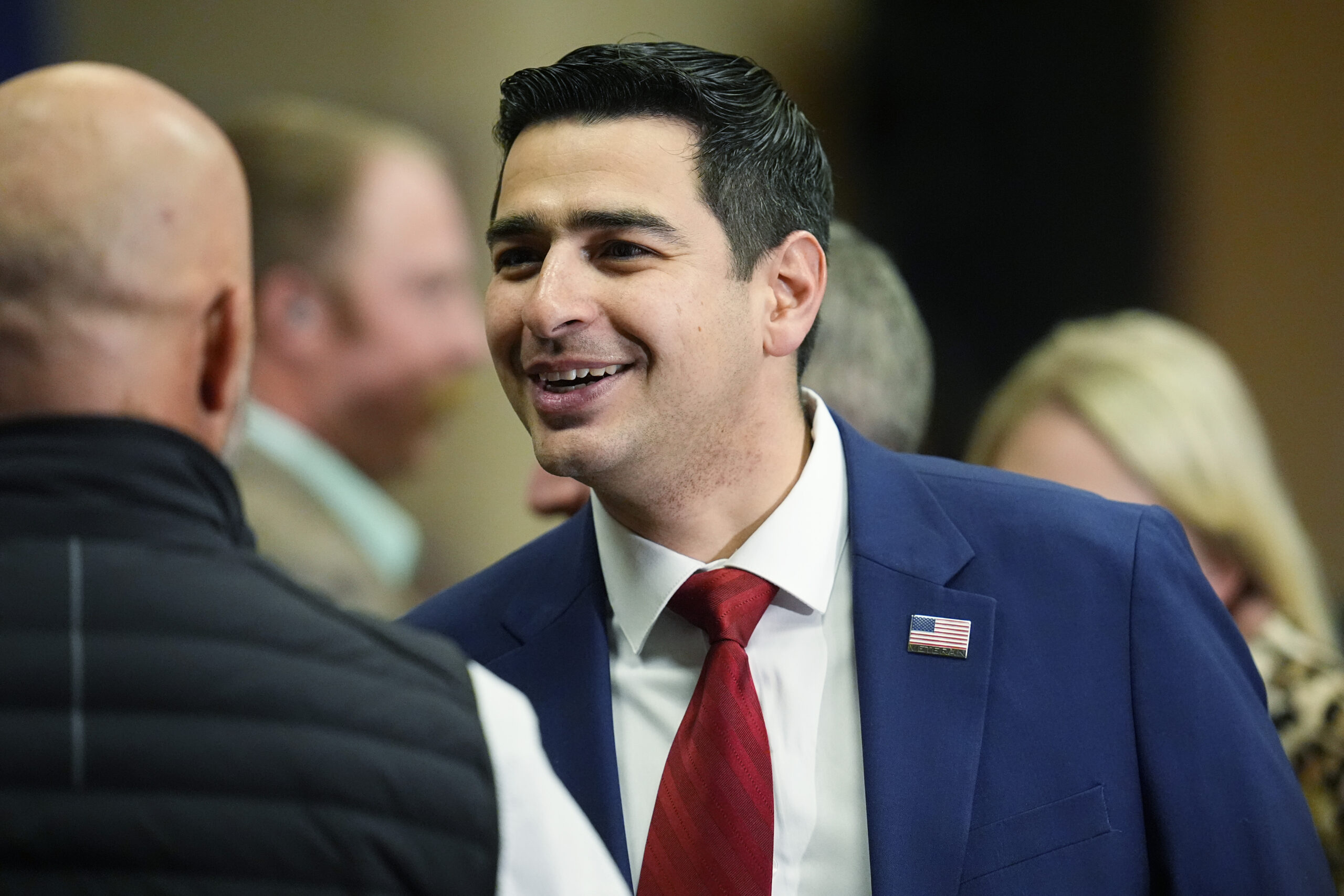 FILE - Colorado Rep. Gabe Evans talks to well-wishers before the first Republican primary debate fo...