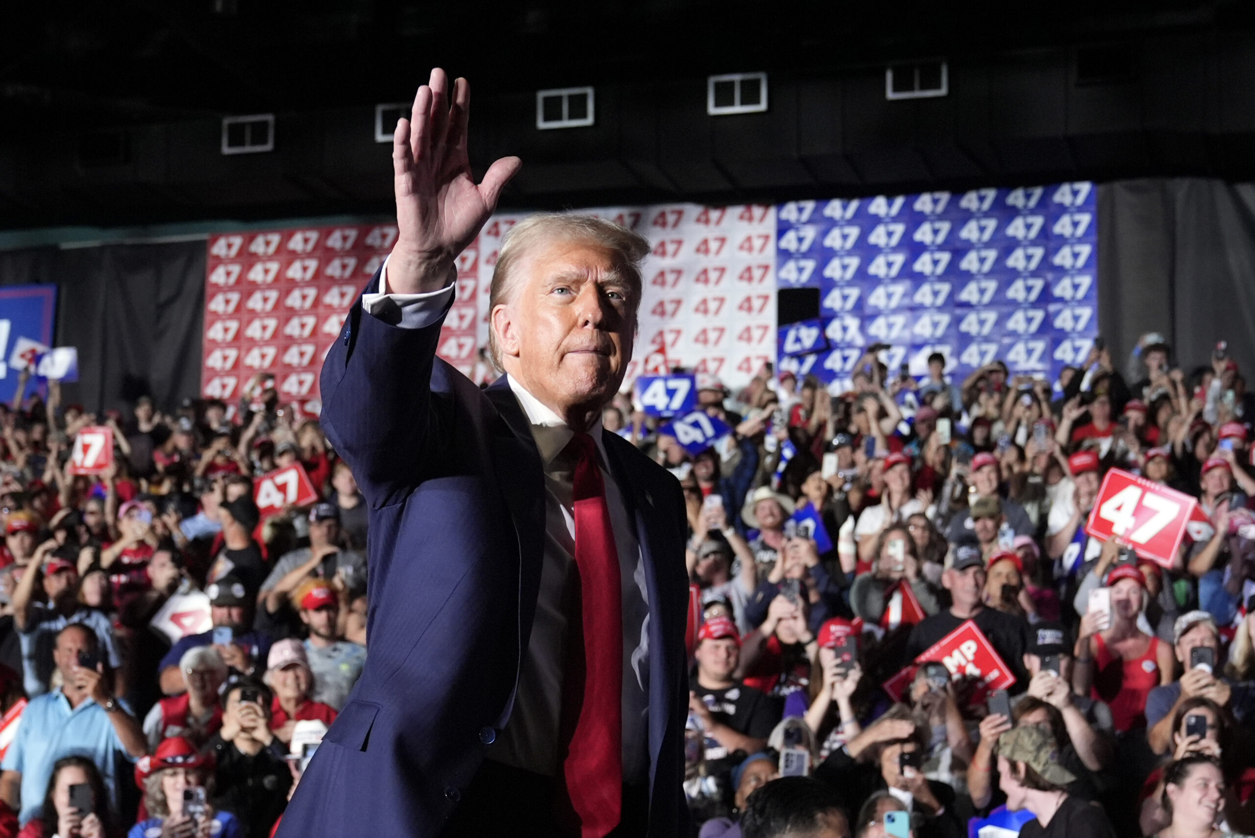 Republican presidential nominee former President Donald Trump waves at a campaign rally at Greensbo...