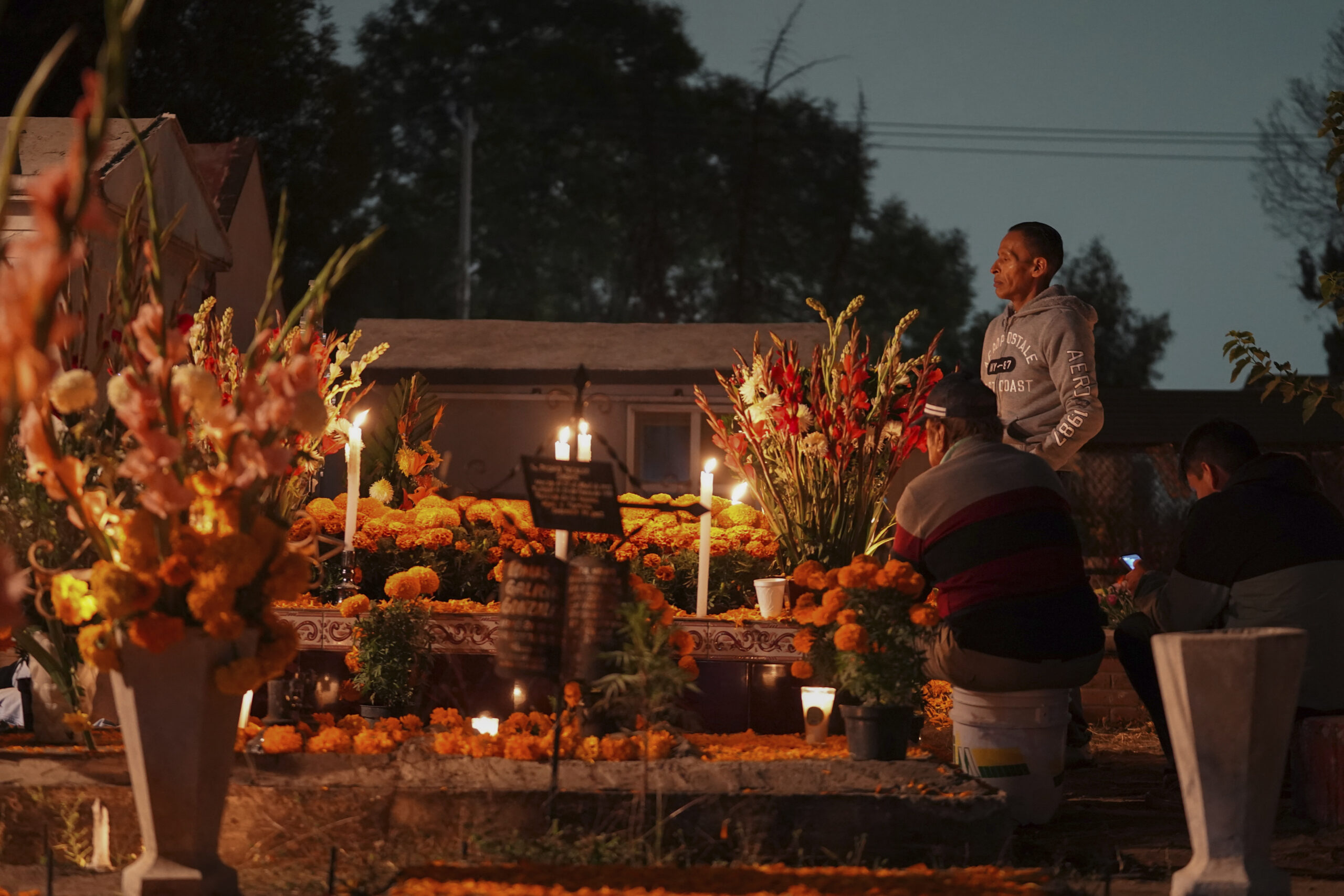 Families gather by the tomb of their dearly departed, as they celebrate the Day of the Dead, at the...