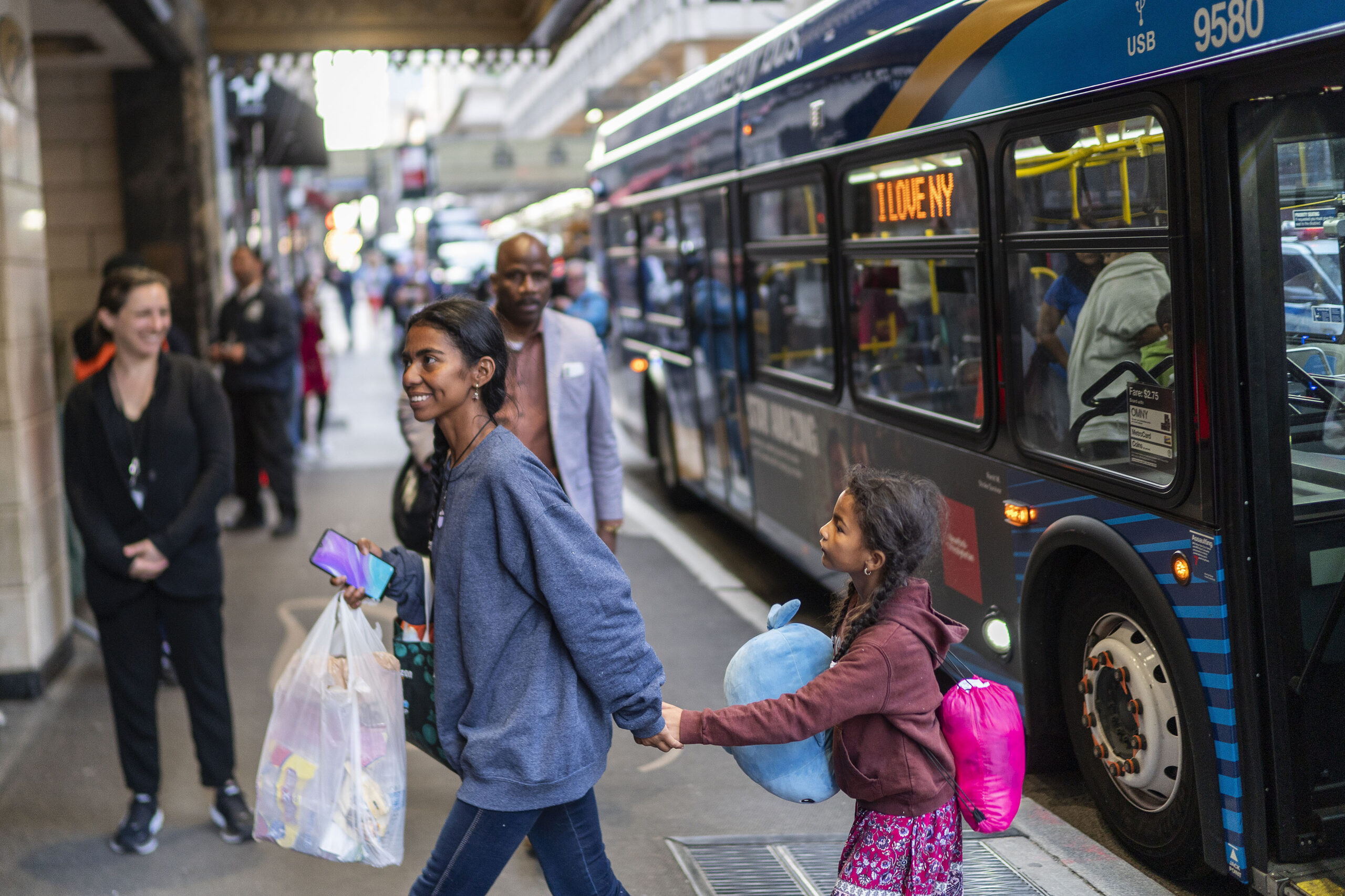 FILE - Asylum seekers arrive at the Roosevelt Hotel on Friday, May 19, 2023, in New York. (AP Photo...