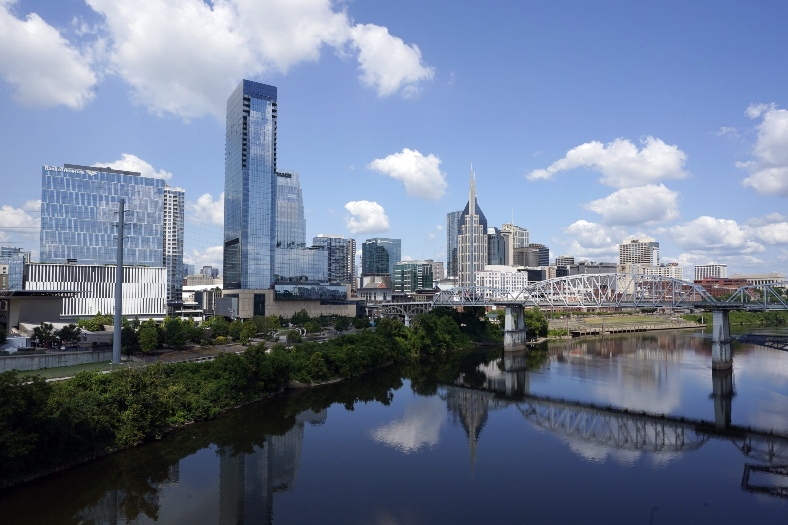 FILE - The Nashville, Tenn., skyline is reflected in the Cumberland River July 11, 2022. (AP Photo/...