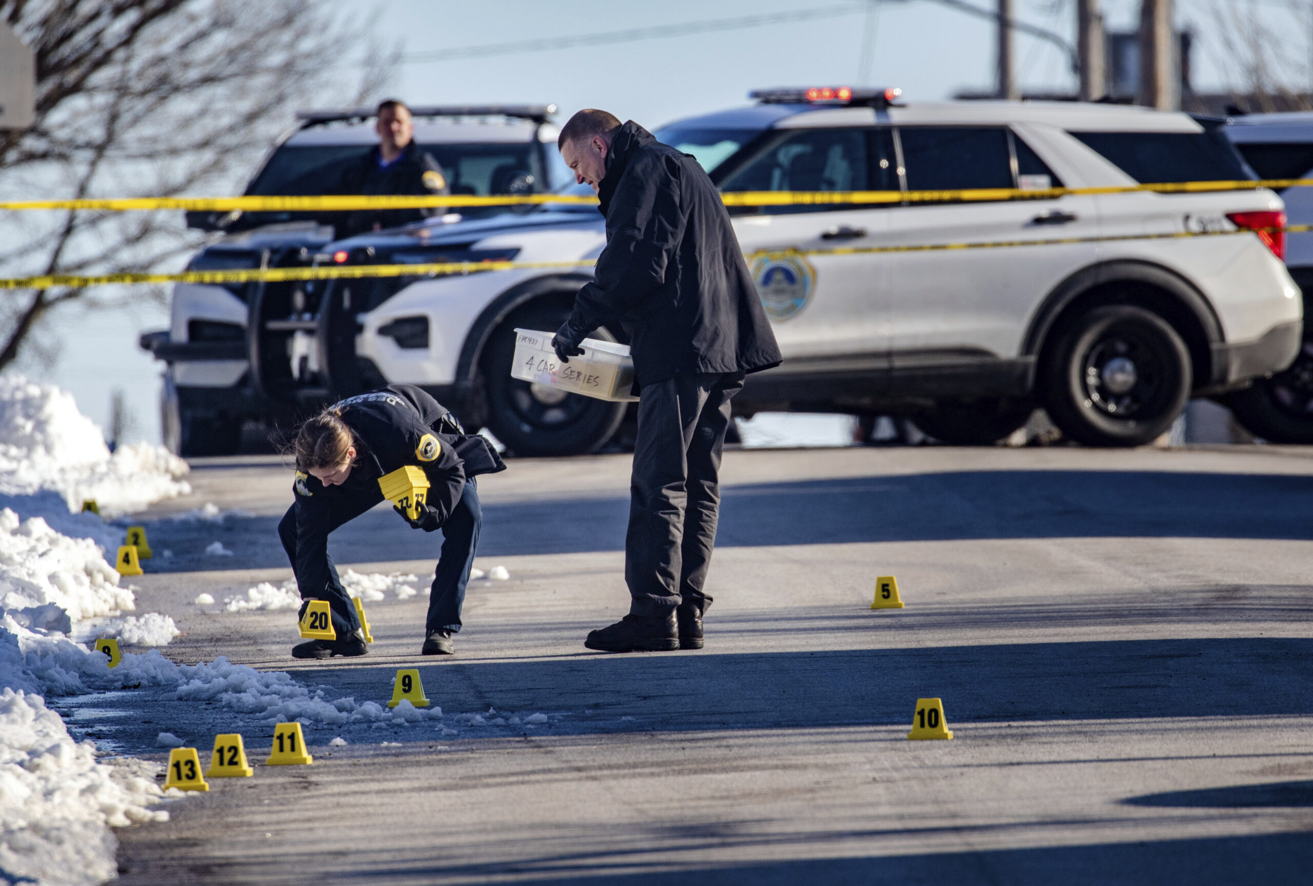 FILE - Police investigate a fatal shooting outside of East High School in in Des Moines, Iowa, on M...