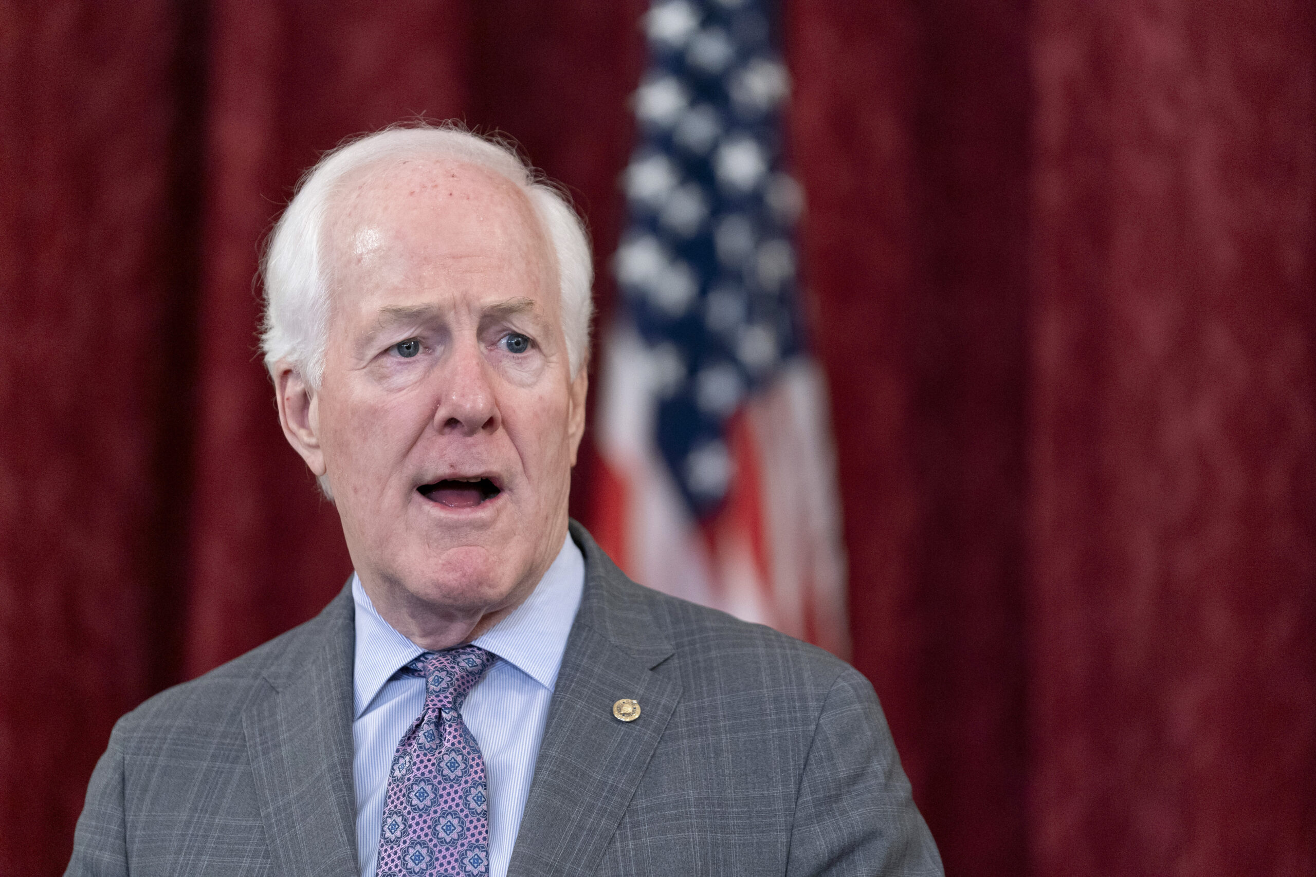 FILE - Sen. John Cornyn, R-Texas, speaks to media, Oct. 18, 2023, on Capitol Hill in Washington. (A...