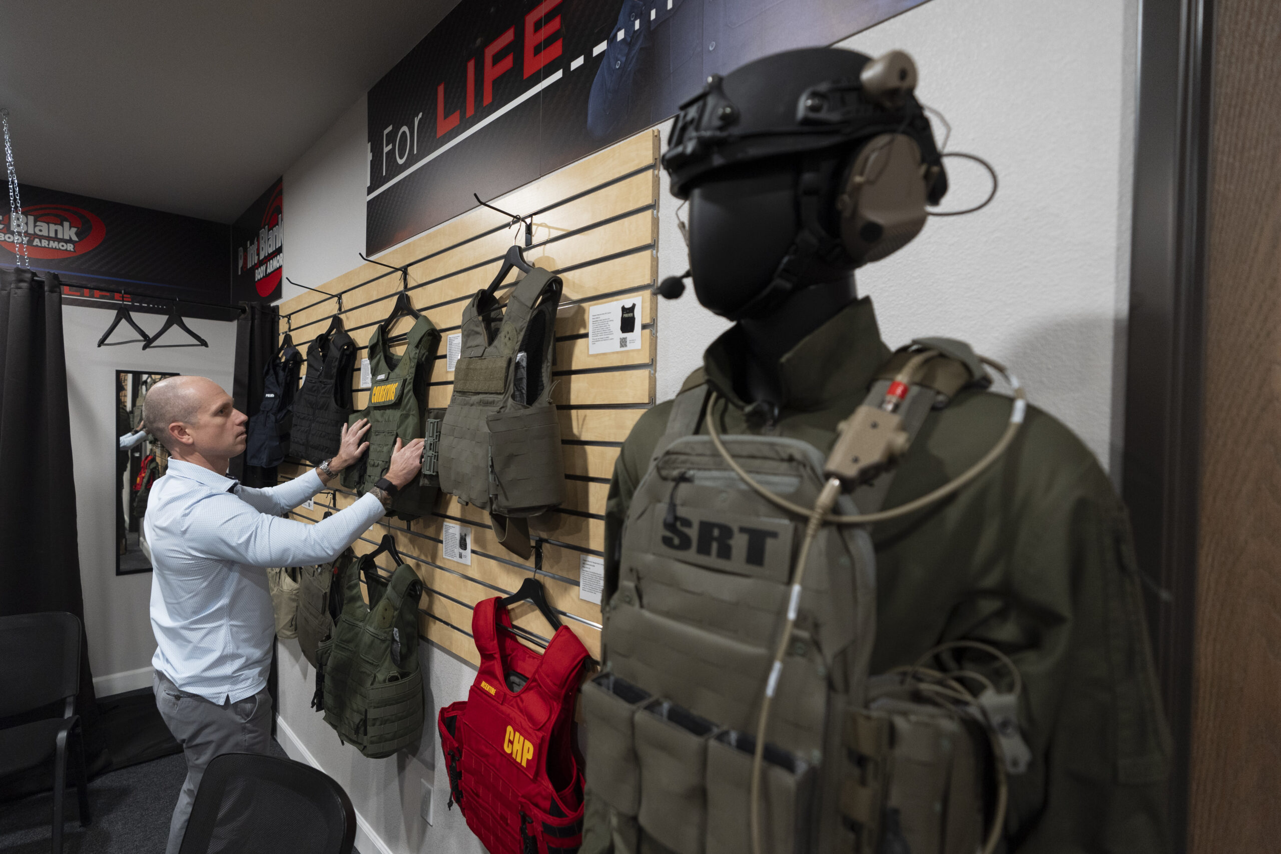 Veteran and business owner Jackson Dalton arranges protective gear at the Black Box Safety offices,...