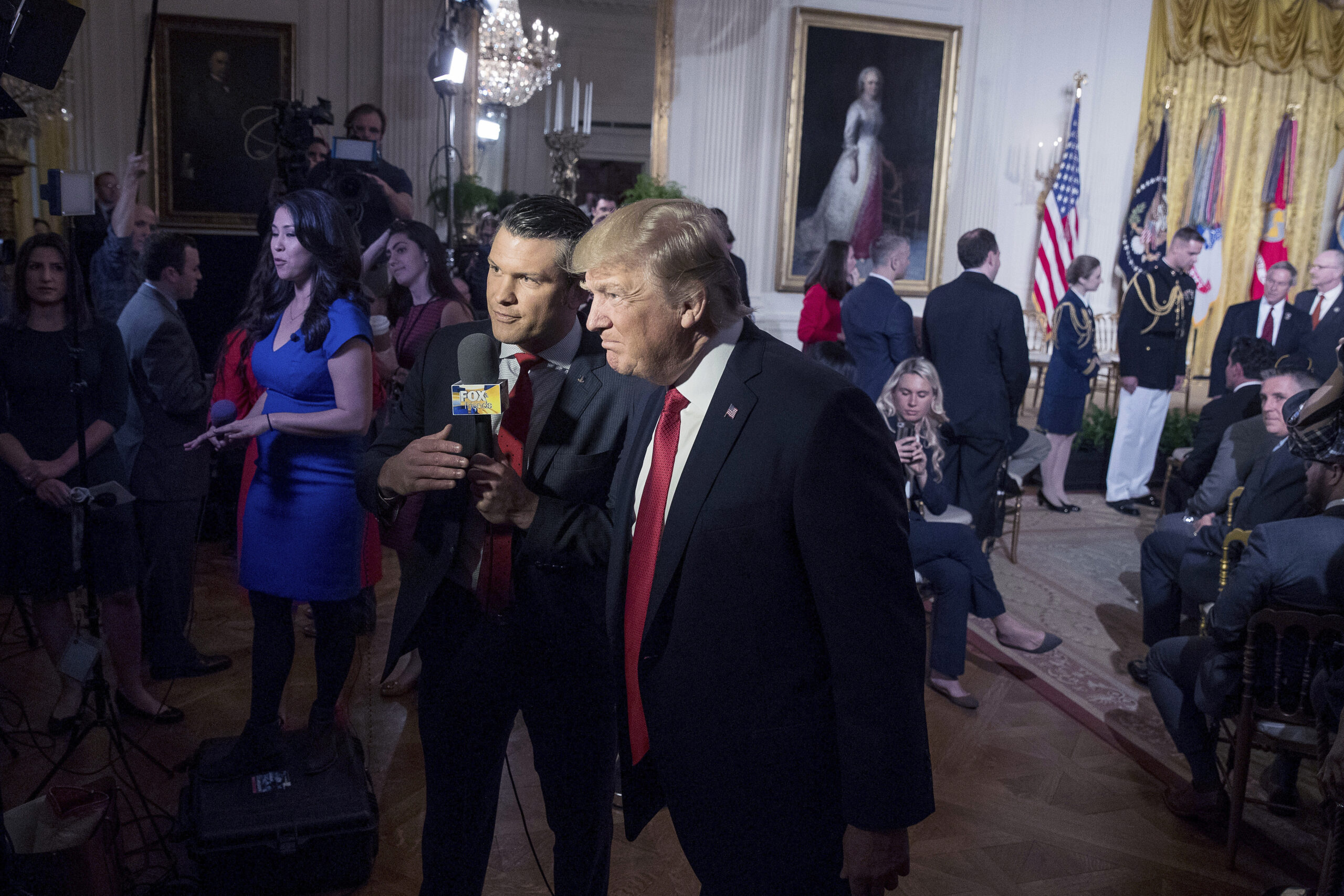 File - President Donald Trump appears on Fox & Friends co-host Pete Hegseth at a Wounded Warrior Pr...