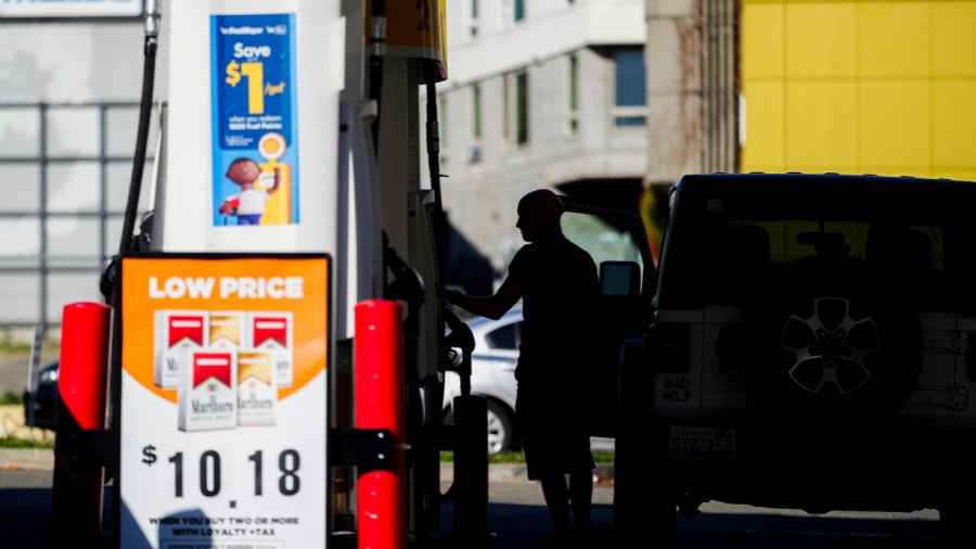 Image: A driver fills up at a pump at a Shell gas station in Seattle on Wednesday, Oct. 9, 2024....