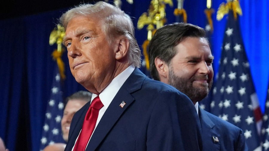 Image: President-elect Donald Trump and Vice President-elect JD Vance stand on stage at an election...