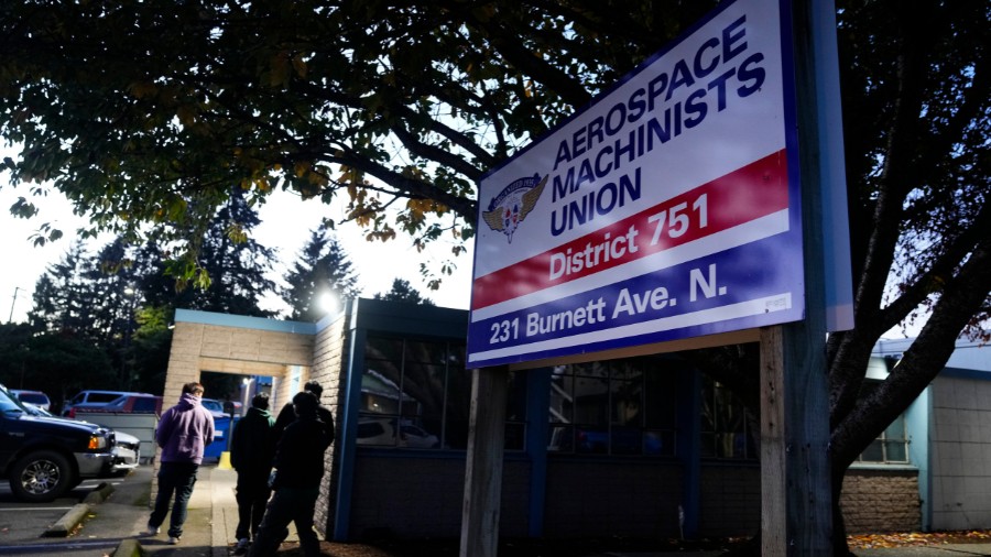 Image: Boeing employees arrive to vote on a new contract offer from the company Monday, Nov. 4, 202...