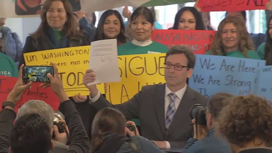 Photo: On Monday, Ferguson signed an executive order to help children if their parents are deported...