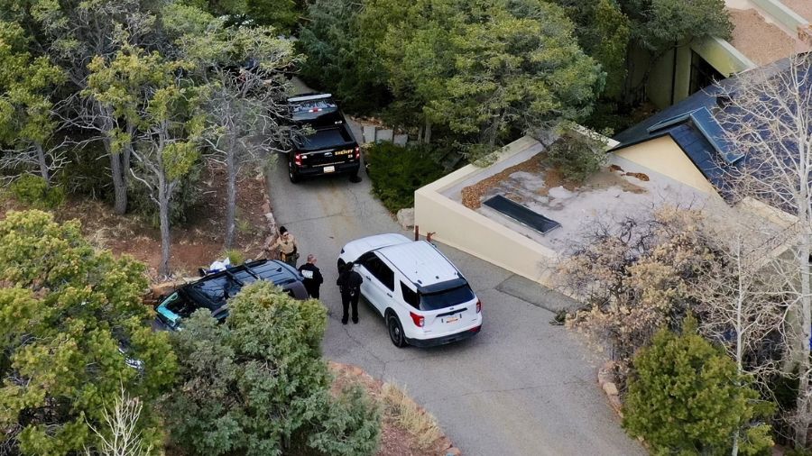 Law enforcement officials talk outside the home of actor Gene Hackman on Thursday, Feb. 27, 2025 in...