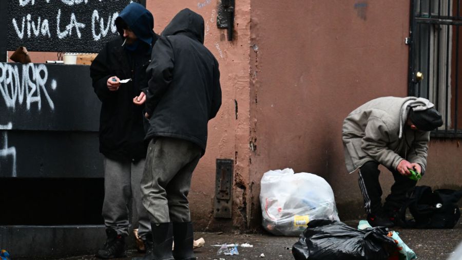 Photo: A person holds a foil while smoking. A Washington police chief has reported fentanyl is on t...