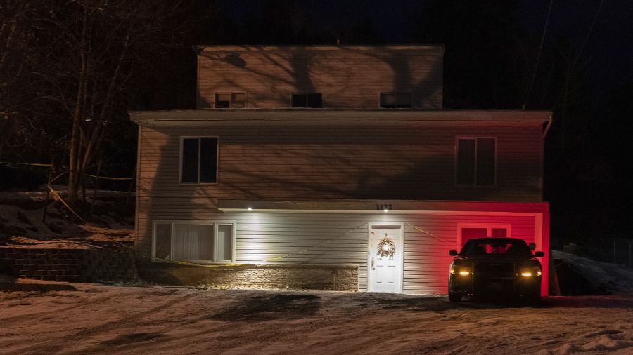 Photo: A private security officer sits in a vehicle on Jan. 3, 2023, in front of the house in Mosco...