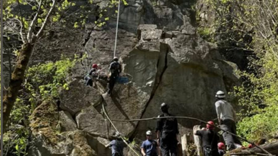 Rescuers work to bring a rock climber to safety after a fall near the town of Index on Saturday. (P...