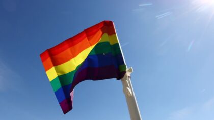 Man charged with hate crime after burning, spreading feces on Pride flag