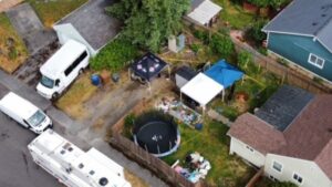 Crews with Tacoma Emergency Management were seen digging in the backyard of a home. (Photo: @PhotogSteve81)