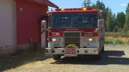 Two Mason County firefighters walk away unharmed after fire truck rolls over on highway