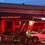 The damages seen after an SUV crashed into Mioposto in Ravenna Friday night. (Photo courtesy of Mioposto)