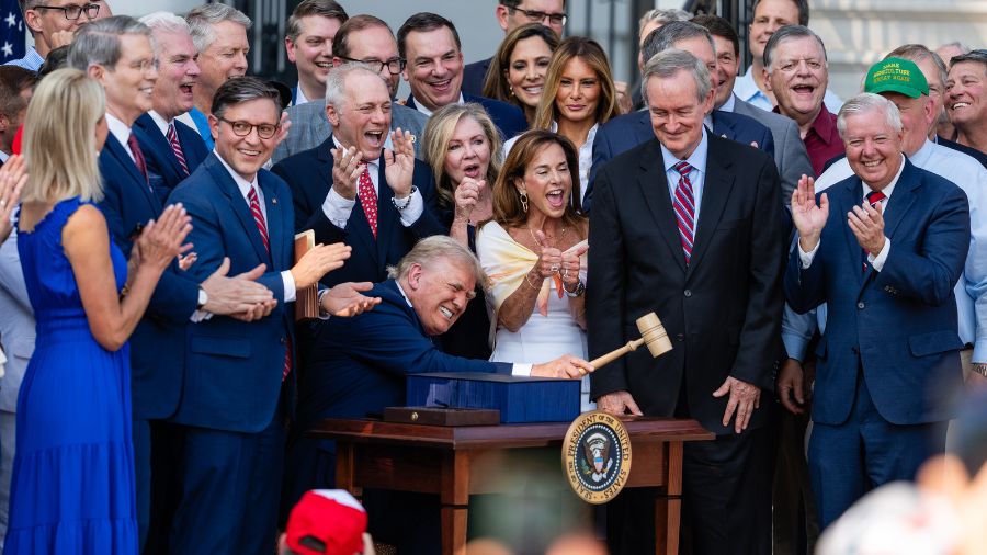 U.S. President Donald Trump, joined by Republican lawmakers, holds a gavel after signing the "One, ...
