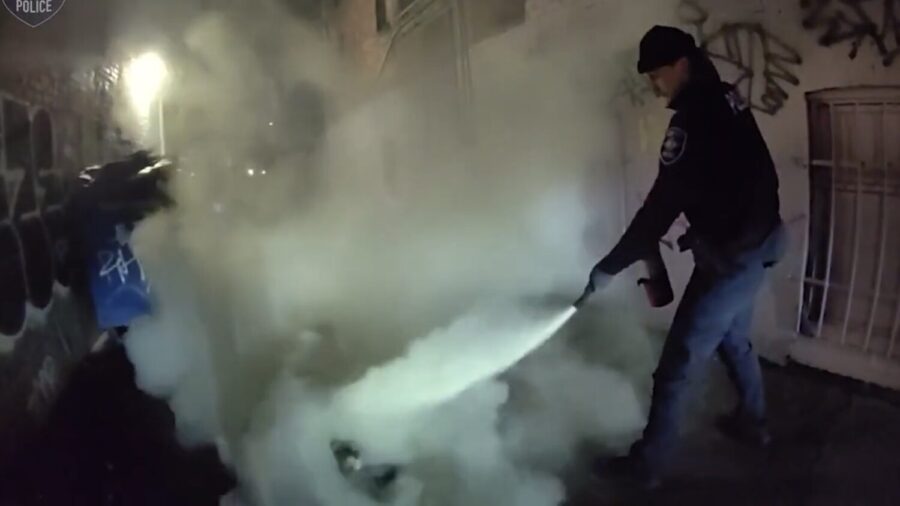 Seattle police rescue man from fire in alley