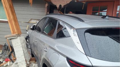 Car crashes into Everett home, injuring 2
