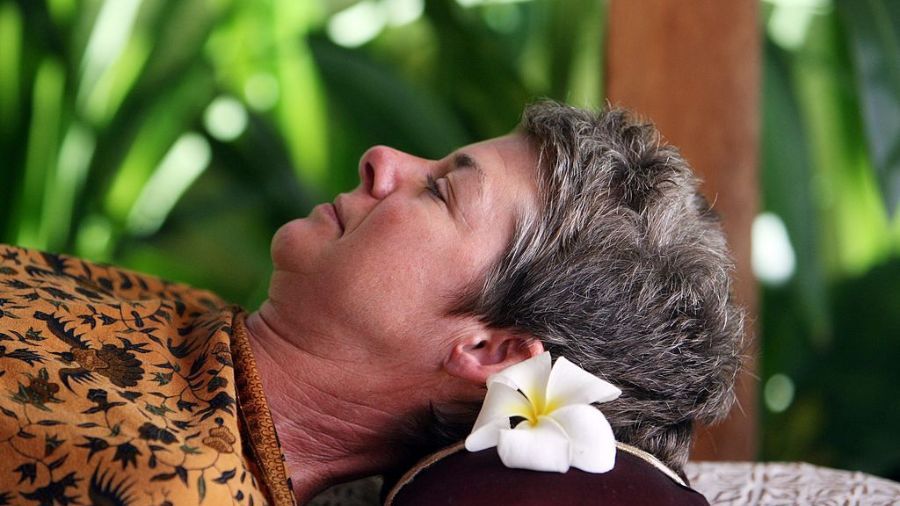 A woman receives a massage during a spa treatment. (Photo: Dimas Ardian, Getty Images)...