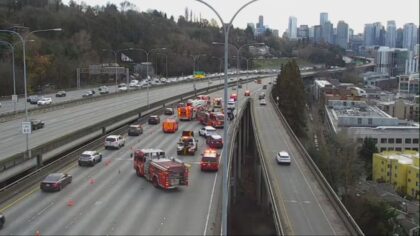 Three people rescued after car turns over on I-5 in Seattle