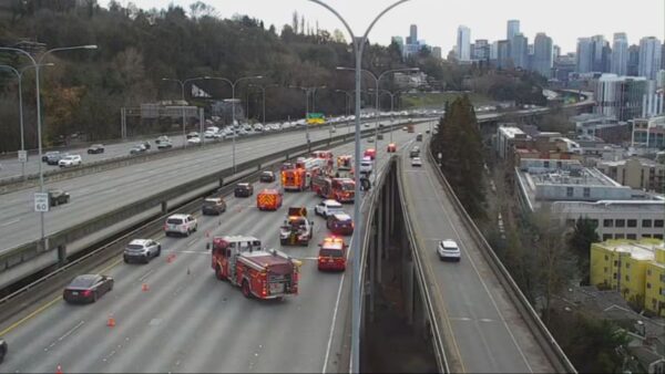 Three people rescued after car turns over on I-5 in Seattle