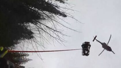 Two hunters trapped by high water from the flooded Suiattle River rescued by helicopter by the Coast Guard and Washington National Guard. (Photo: U.S. Coast Guard)