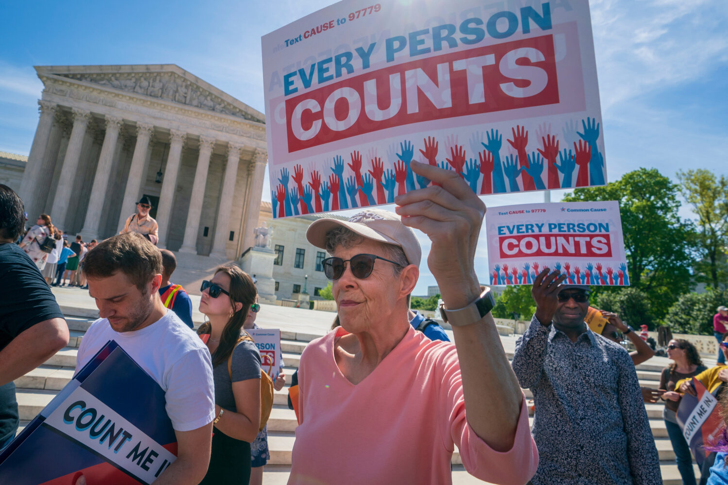 Immigration activists rally outside the Supreme Court as the justices hear arguments over the Trump...