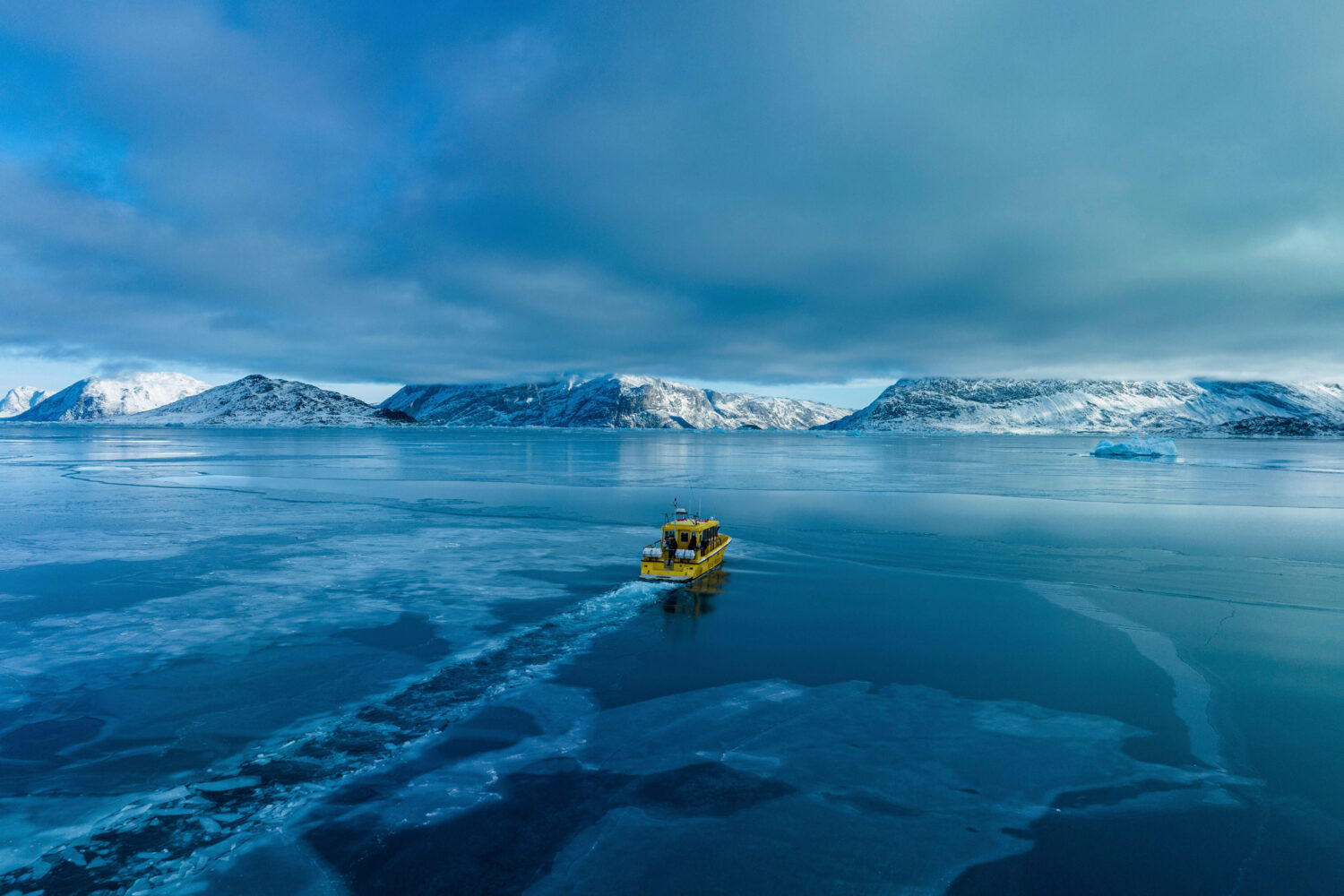 FILE - A boat rides though a frozen sea inlet outside of Nuuk, Greenland, on March 6, 2025. (AP Pho...