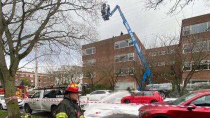 Crews still restoring power in Queen Anne after bucket truck struck line, leaving worker stuck on crane