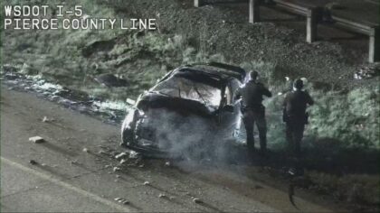 Ejected driver allegedly threatens good Samaritan with gun after I-5 rollover crash