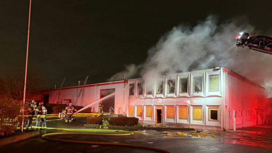 Fire crews knocked down a two-alarm fire at a vacant commercial building in Kent late Wednesday nig...