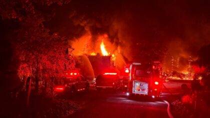 Redmond Fall City Road reopens after large fire consumes warehouse, destroys 15 cars in Ames Lake