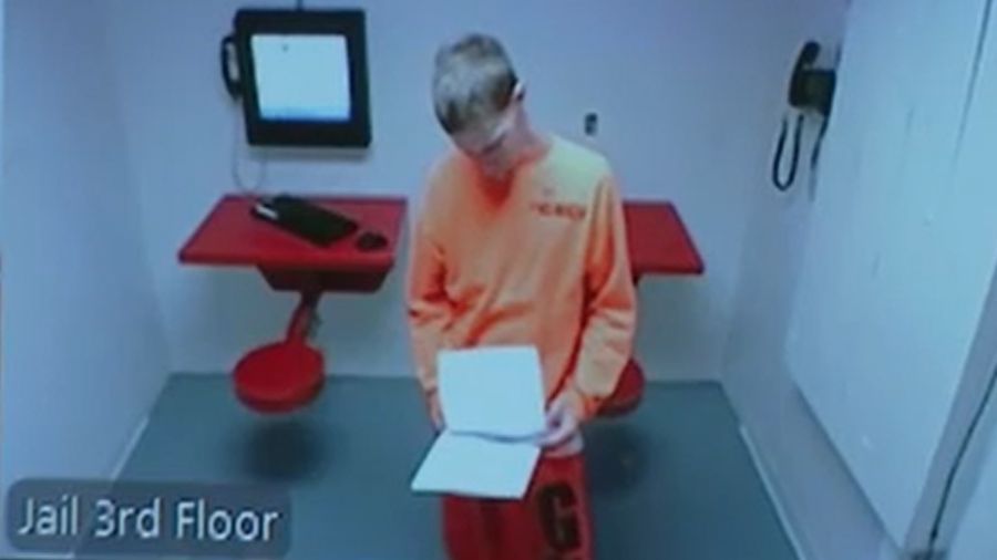 Jacob Bevins, the boy's father, appears on a video screen during a courtroom hearing in Grays Harbo...