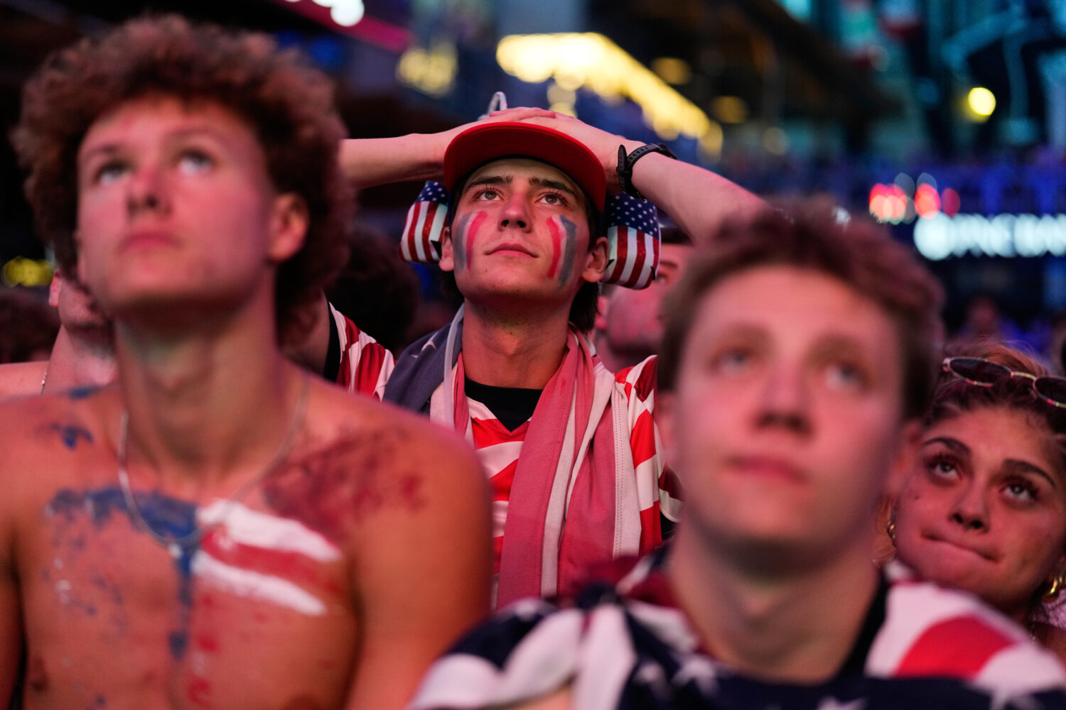 Fans react to a United States loss during a watch party for a World Cup round of 16 soccer match be...