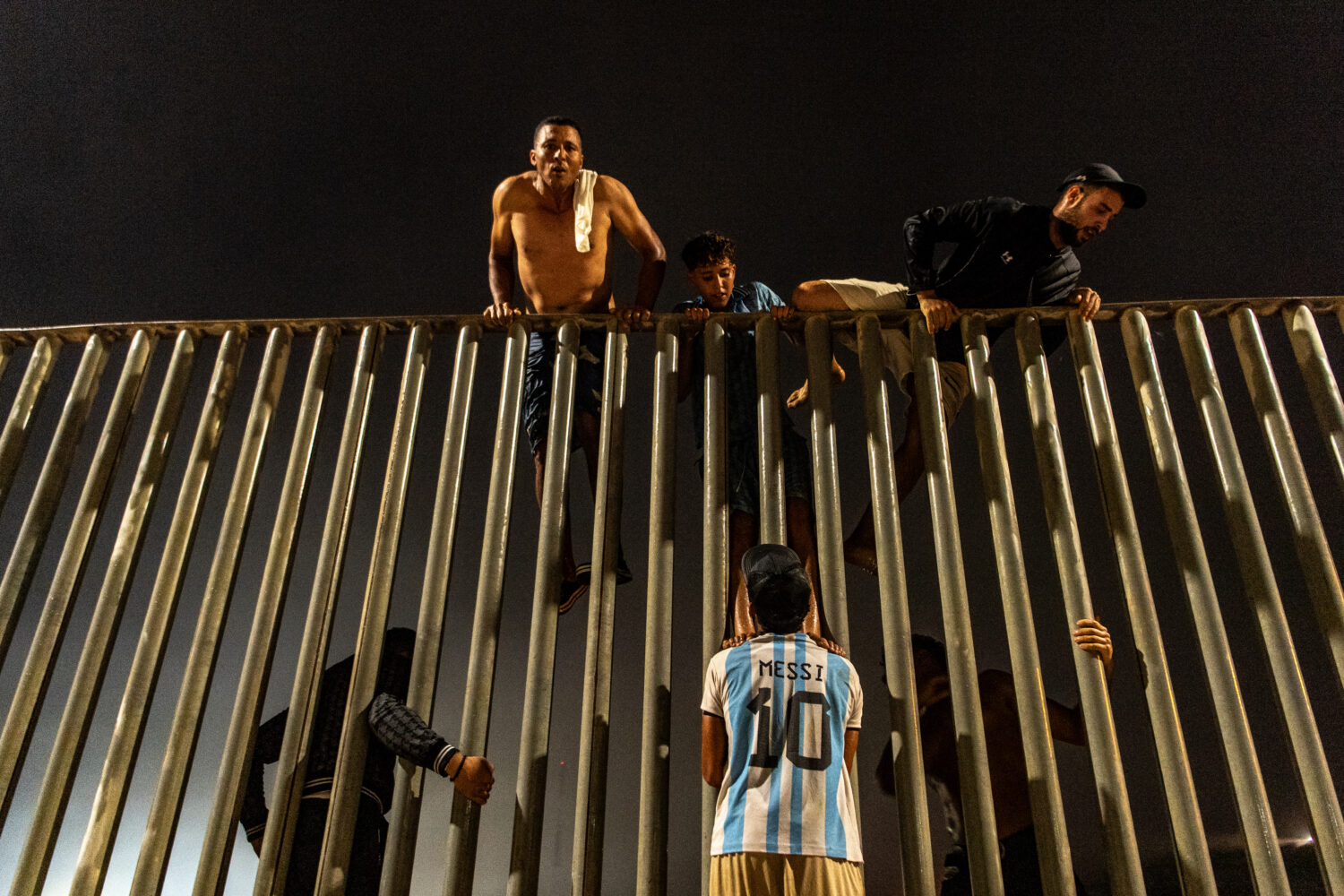 Migrants try to cross from Morocco into the Spanish enclave of Ceuta, Friday, July 31, 2026. (AP Ph...