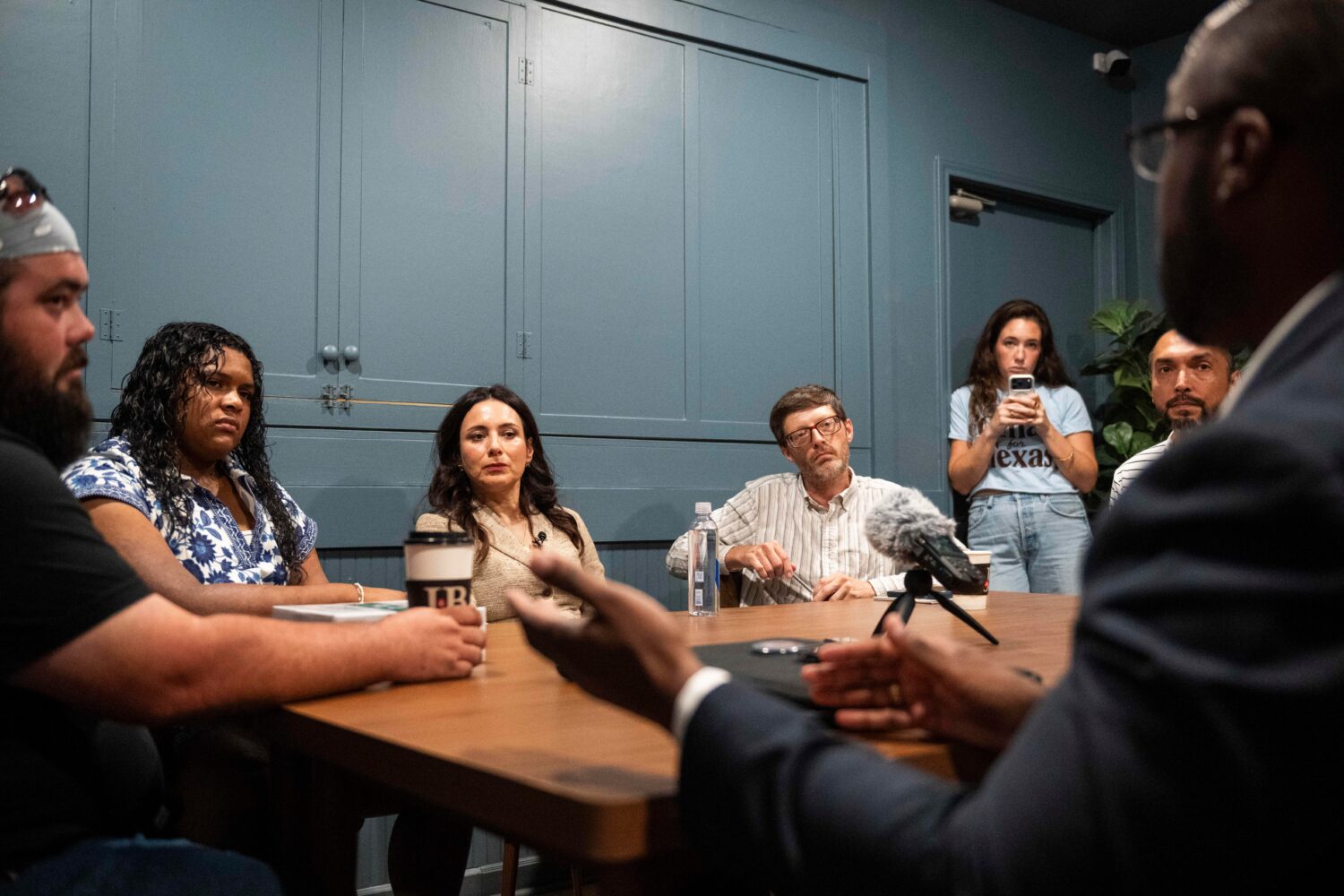 Democratic candidate for Texas governor Gina Hinojosa, third from the left, listens to Stephen Sand...