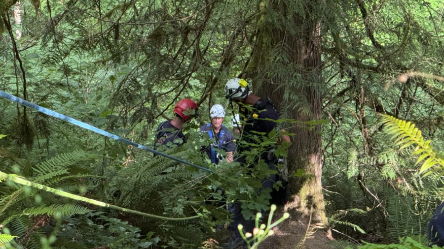 Crews set up several rope systems on a steep slope, in this rescue effort Saturday, at the Green Ri...